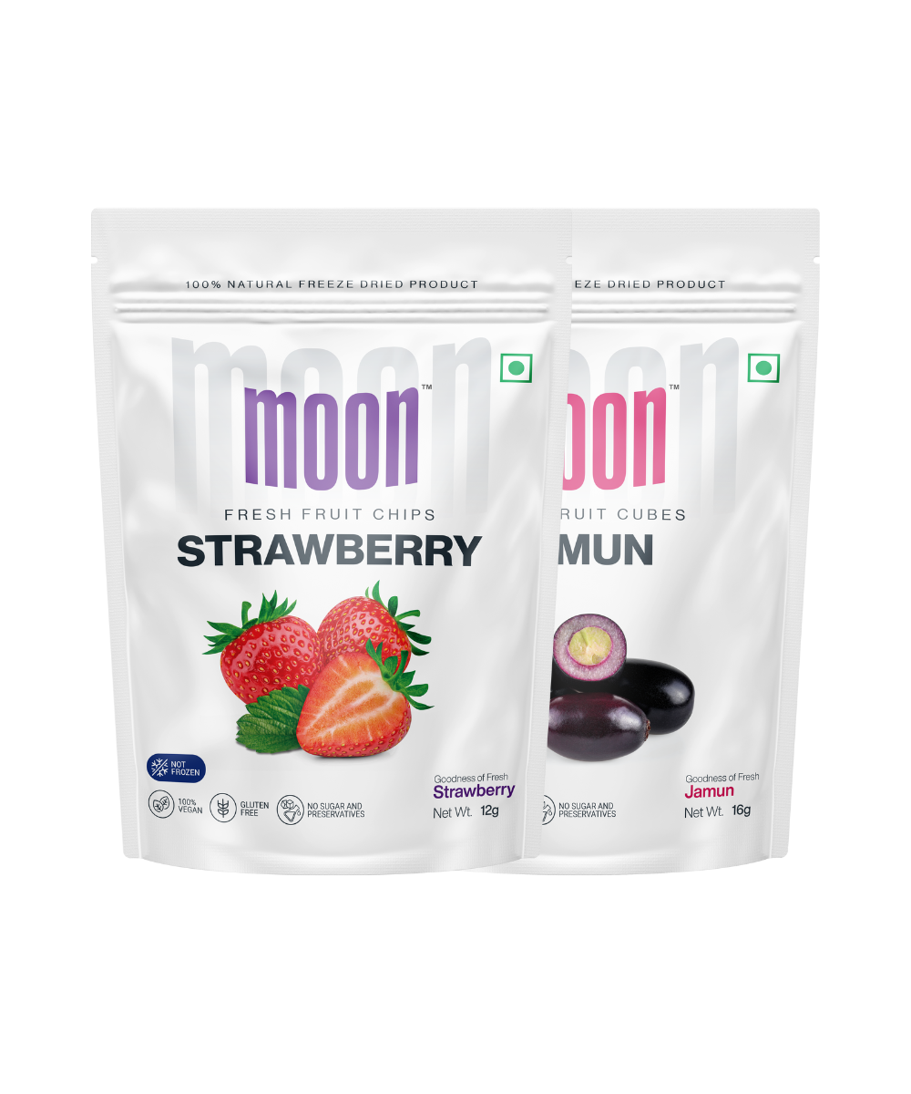 Two packages of MOONFREEZE FOODS PRIVATE LIMITED moon freeze-dried fruit, one with strawberry chips and the other with jamun cubes.
