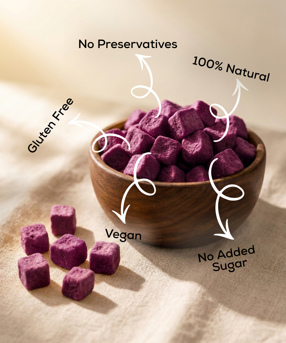 A wooden bowl of Moon Freeze Dried Jamun Cubes from Themoonstoreindia, labeled gluten-free, vegan, 100% natural, with no preservatives or added sugar—a perfect healthy treat for natural sugar cravings.