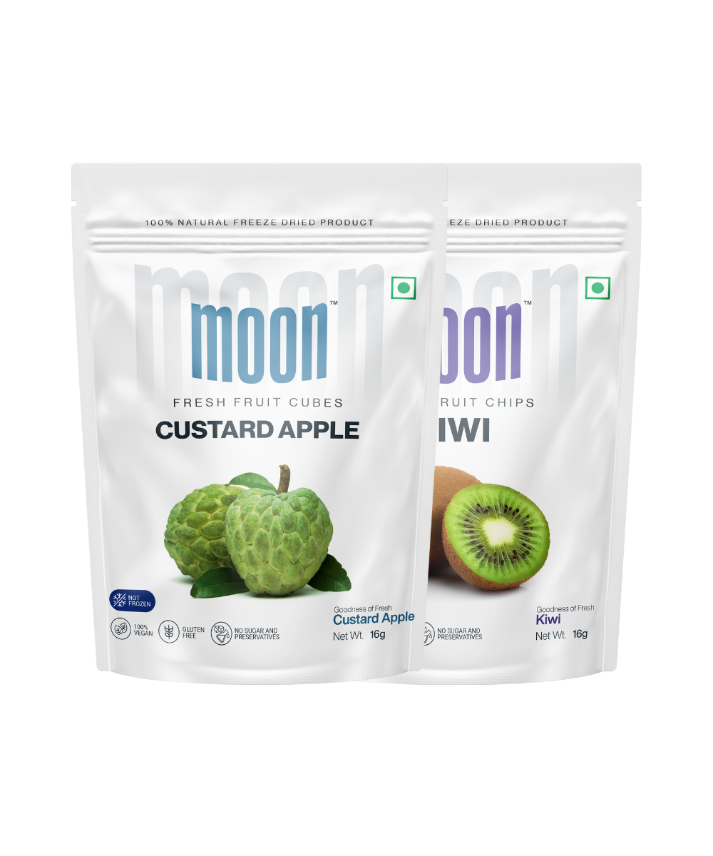 Two packages of MOONFREEZE FOODS PRIVATE LIMITED brand Moon Freeze Dried Custard Apple + Kiwi snacks, one with custard apple cubes and the other with kiwi chips.