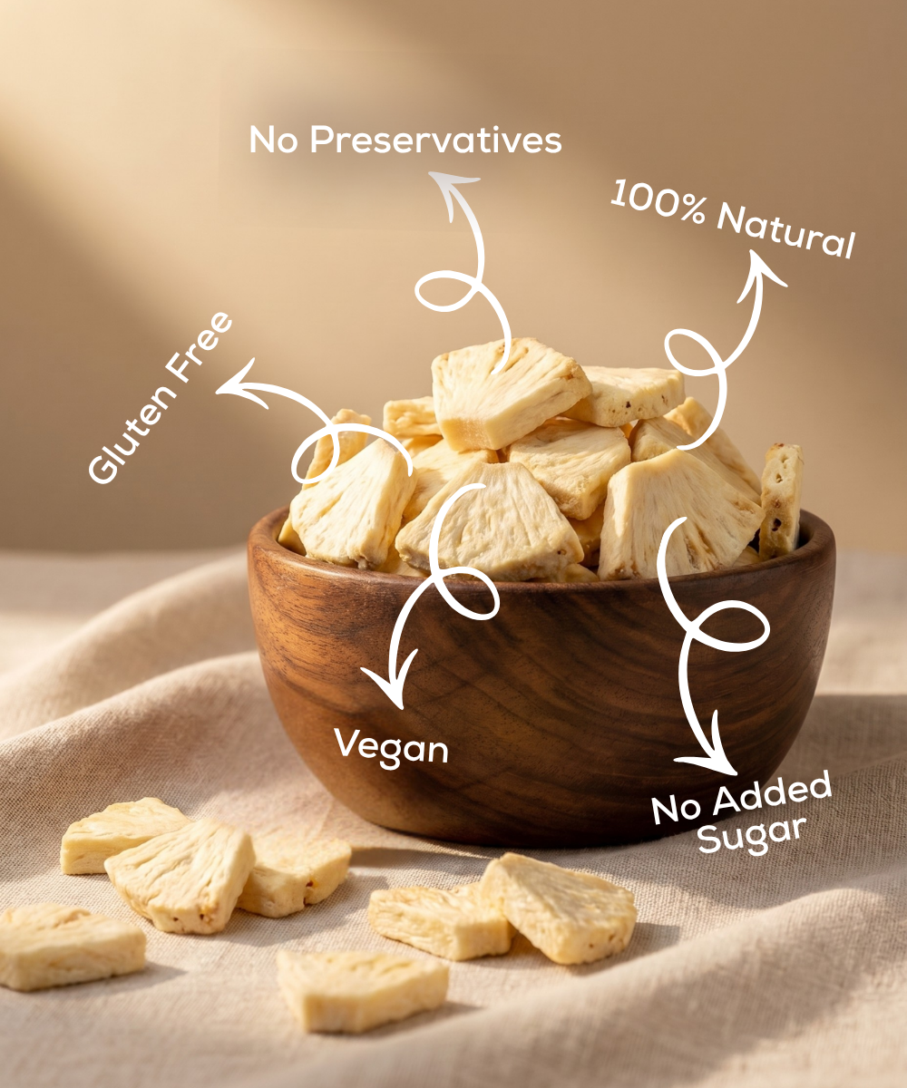 Moon Freeze Dried Pineapple by Themoonstoreindia shown in a wooden bowl on a beige clothβa healthy snack that's gluten-free, vegan, 100% natural, with no added sugar or preservatives.