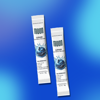 Two tubes of Moon Lunar Hydration Stick with electrolytes on a blue gradient background by MOONFREEZE FOODS PRIVATE LIMITED.