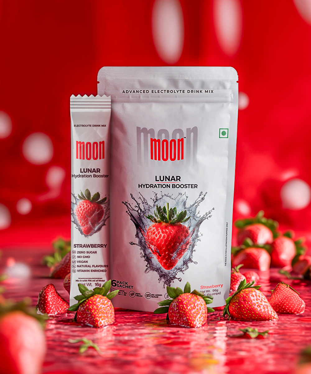 The Lunar Hydration Booster - Strawberry Flavour by MOONFREEZE FOODS PRIVATE LIMITED is elegantly presented among strawberries on a red background, emphasizing its key benefits of essential electrolytes and zero added sugar.