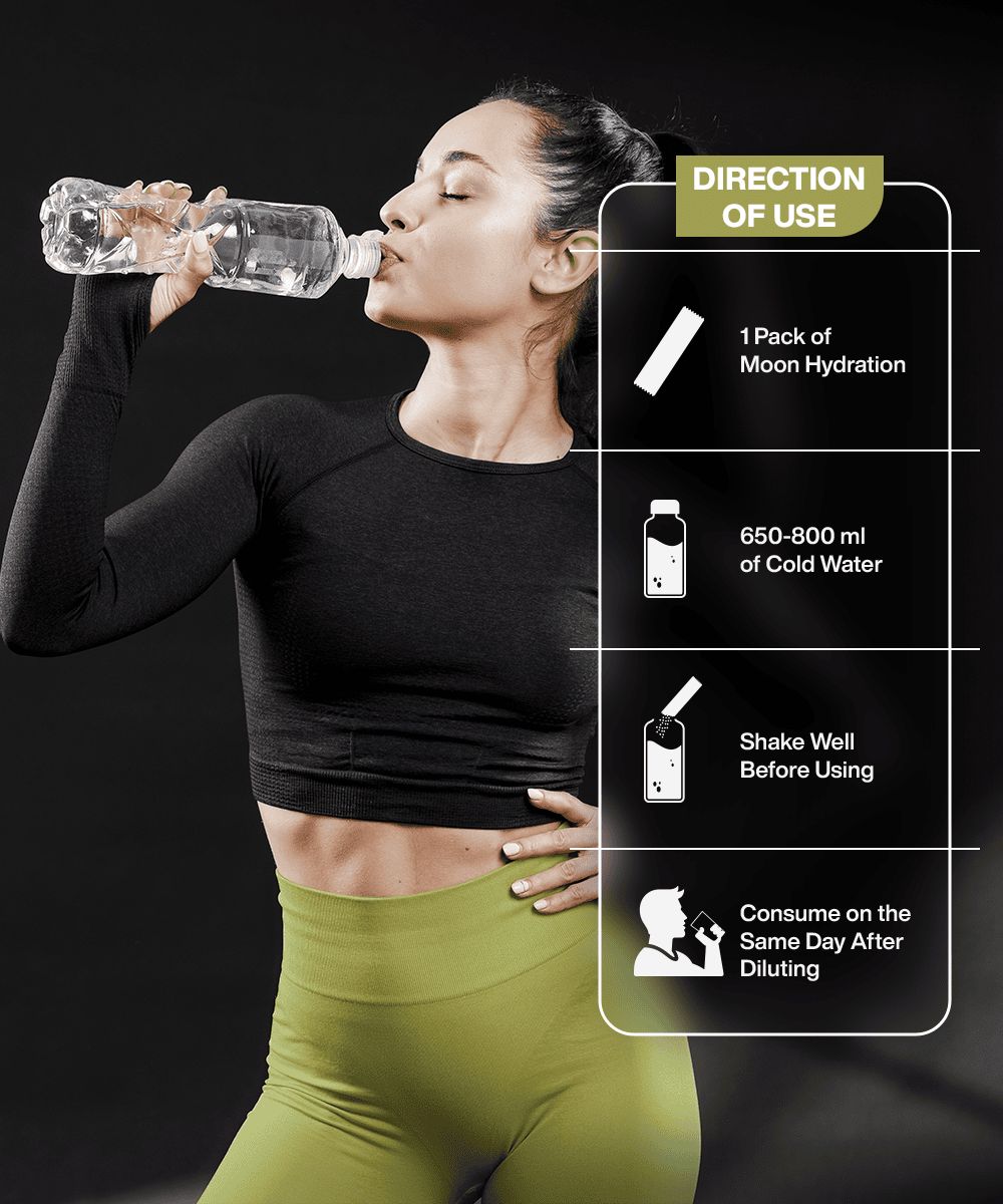 A woman in athletic wear drinks from a bottle with instructions nearby suggesting to mix Lunar Hydration Booster - Watermelon by MOONFREEZE FOODS PRIVATE LIMITED with 650-800 ml of cold water. It contains essential electrolytes and B-vitamin complex, recommended for consumption on the same day.