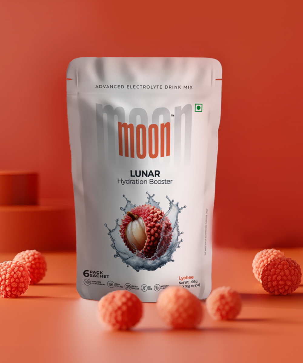 A packet of Moon Freeze Astronaut's Diet Pack - Refresh Edition advanced electrolyte drink mix with a lychee flavor, surrounded by lychee fruits against an orange background. Brand Name: MOONFREEZE FOODS PRIVATE LIMITED.