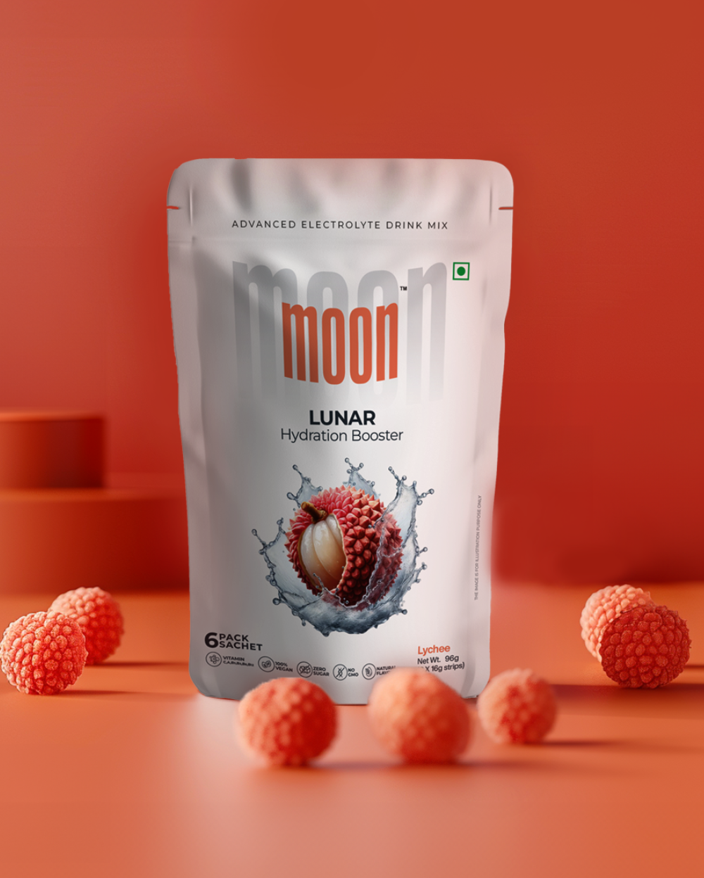 Package of Moon Lunar Strawberry + Lychee Hydration Booster electrolyte drink mix by MOONFREEZE FOODS PRIVATE LIMITED on a red background with lychee and strawberry fruits scattered around.
