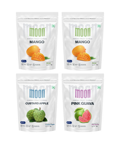 Four packages of Moon Freeze Celestial Signature Series freeze-dried fruit snacks, featuring mango, custard apple, and pink guava tropical flavors by MOONFREEZE FOODS PRIVATE LIMITED.