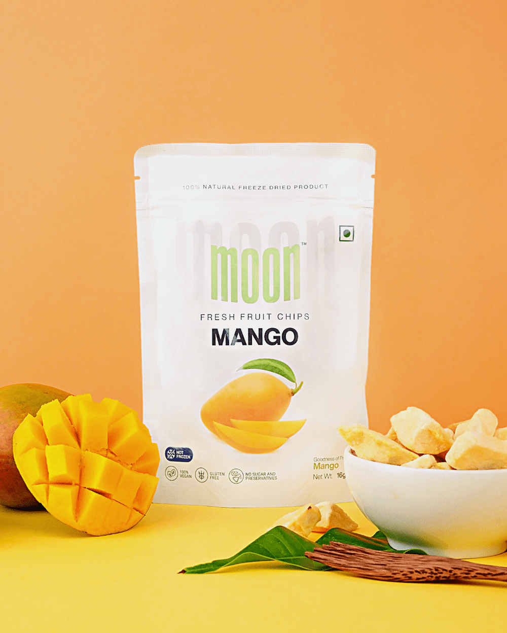 A bag of Moon Freeze Dried Mangoes with a bowl next to it from Themoonstoreindia.