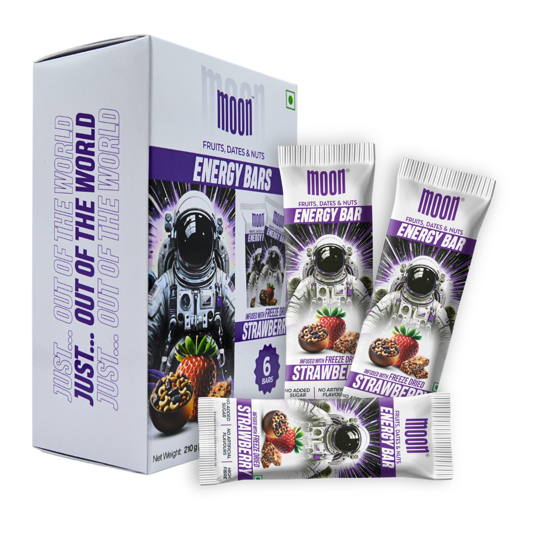 A box of MOONFREEZE FOODS PRIVATE LIMITED's MOON Energy Bar - Strawberry (6 Pack), featuring a space-themed design with an astronaut, labeled "Fruits, Dates & Nuts." The flavors include freeze-dried strawberries and the ingredients are listed on the box. Perfect as a meal replacement for your on-the-go adventures.