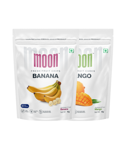 Two pouches of "Moon Freeze Dried Banana + Mango Cubes" by MOONFREEZE FOODS PRIVATE LIMITED are displayed. One pouch features freeze dried banana cubes, and the other features freeze dried mango cubes. Both pouches have images of the corresponding tropical fruits and indicate a net weight of 16 grams each.