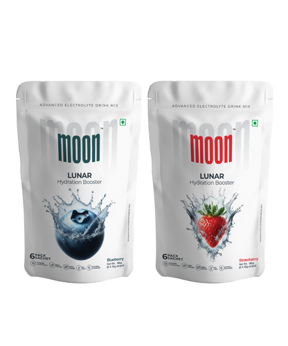 Two pouches of MOONFREEZE FOODS PRIVATE LIMITED Moon Lunar Blueberry + Strawberry Hydration Booster electrolyte drink mix with UV protection.