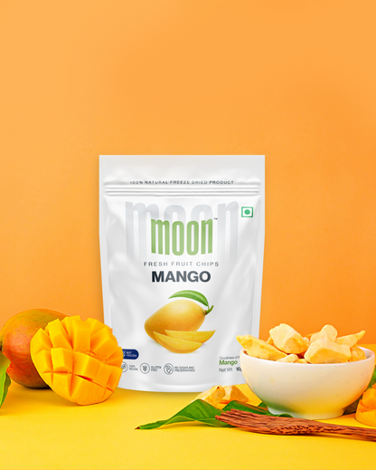 Freeze-dried Mango chips with fresh mango and chips in a bowl.