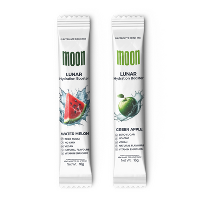 Two packets of Moon Lunar Watermelon and Green Apple Hydration Stick Combo ensure rapid hydration. One is Watermelon flavor, and the other is Green Apple flavor, both zero sugar, non-GMO, vegan, with natural flavors. Discover a similar boost with our Blueberry Hydration Booster by MOONFREEZE FOODS PRIVATE LIMITED.