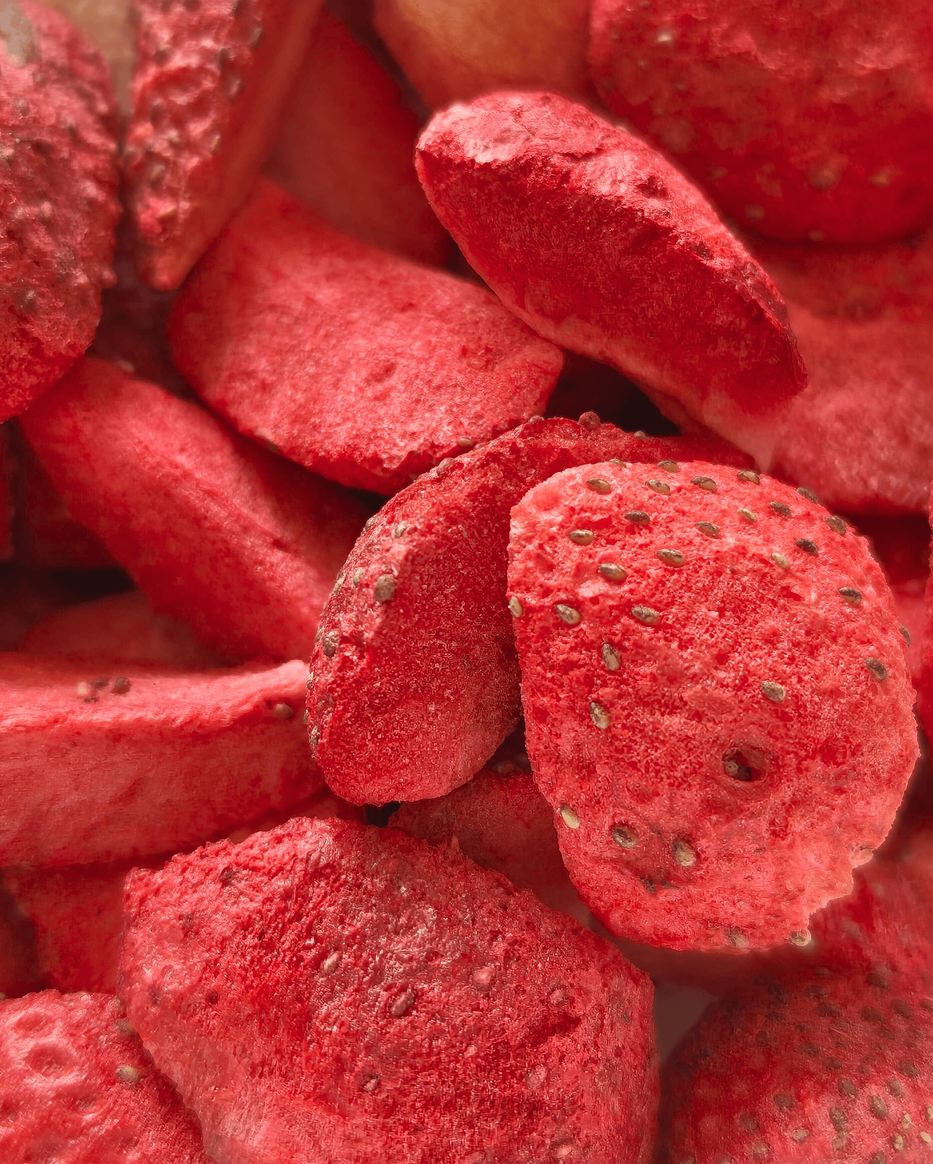 Close-up of vibrant freeze-dried strawberry slices.