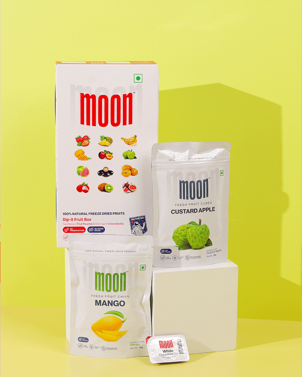 A box of Third Quarter Moon moon and mangoes on a yellow background by MOONFREEZE FOODS PRIVATE LIMITED.