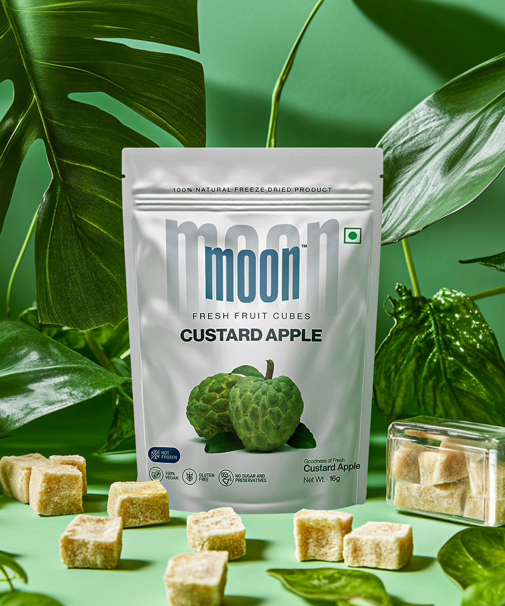 Freeze-Dried Custard Apple Cubes, natural and nutrient-packed, displayed with lush green leaves.