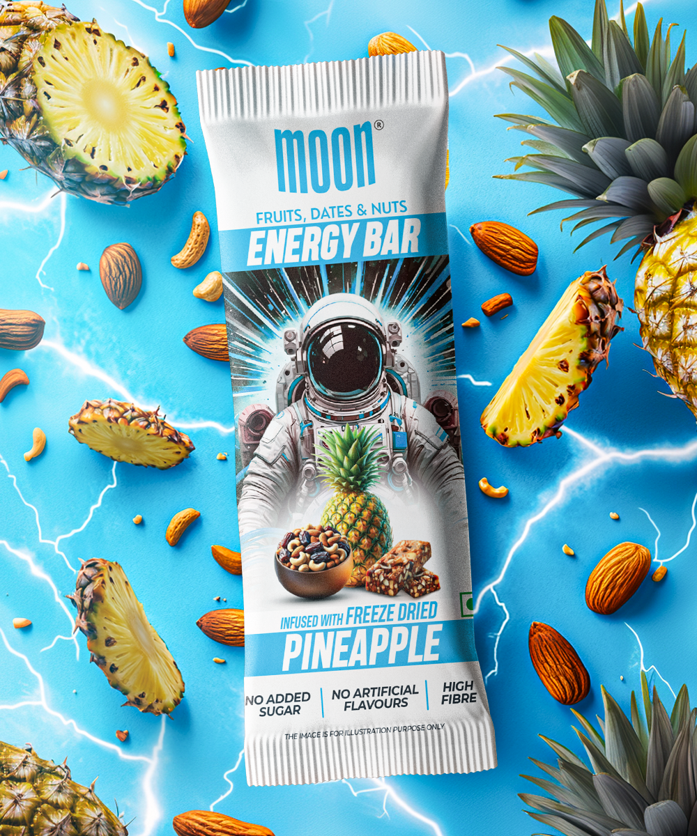 Image of a MOON Energy Bar - Pineapple from MOONFREEZE FOODS PRIVATE LIMITED, surrounded by freeze-dried fruits, nuts, and lightning on a bright blue background. The package mentions no added sugar, no artificial flavors, and high fiber. Perfect as a meal replacement for your busy days! Available in a 6 Pack.