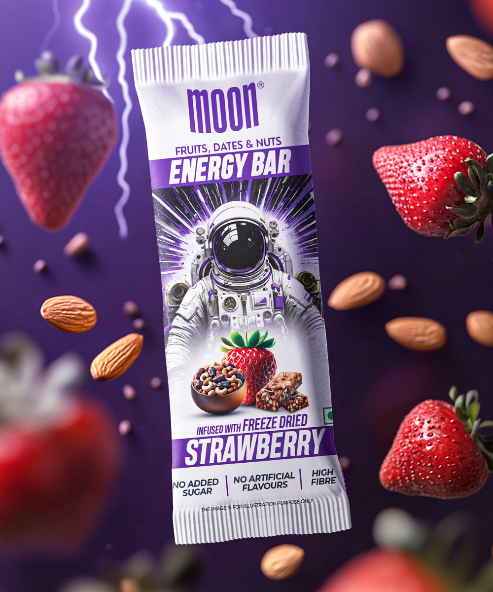 Image of a MOON Energy Bar - Strawberry (6 Pack) by MOONFREEZE FOODS PRIVATE LIMITED, featuring astronaut-themed packaging. Surrounded by floating strawberries, almonds, dates, and nuts against a purple background.