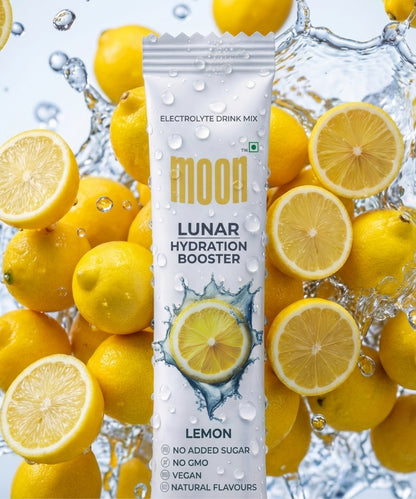 A packet of MOONFREEZE FOODS' Lunar Hydration Booster - Lemon Flavour, a no sugar added electrolytes drink with natural flavors, non-GMO and vegan—shown with fresh lemons and water splashes.