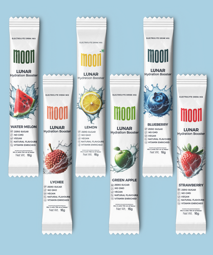 Displayed against a light blue background, the MOONFREEZE FOODS PRIVATE LIMITED Lunar Hydration Booster - Variety Pack offers a selection of six sachets for fast hydration, featuring the electrolyte-rich Blueberry Hydration Booster alongside various flavors such as Watermelon, Lemon, Lychee, Green Apple, and Strawberry.